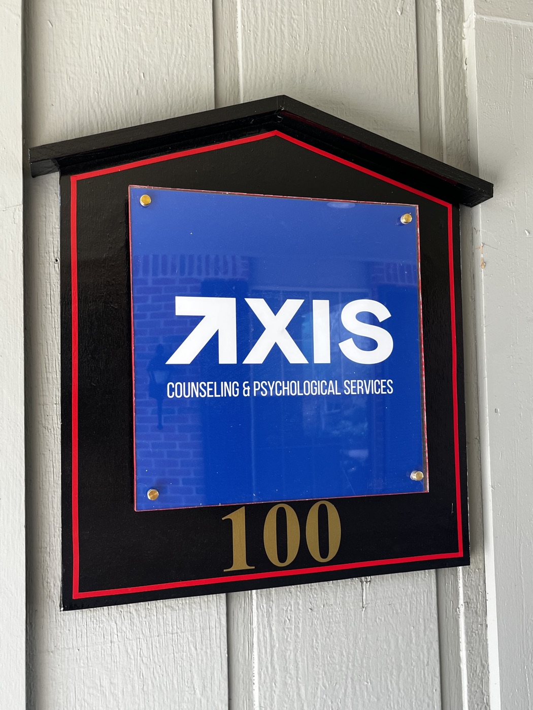 Axis Counseling & Psychological Services sign at Suite 100